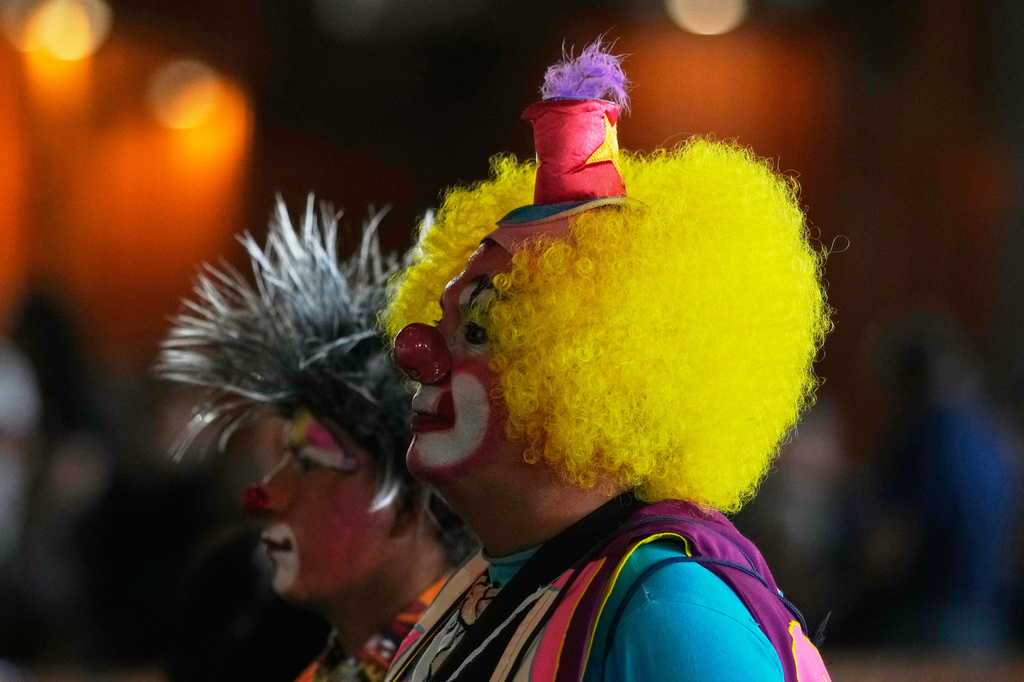 Clowns attend a Mass at the Basilica of Our Lady of Guadalupe to commemorate the 46th anniversary of the Club Payasos Mexicanos de Circo, or Mexican Circus Clowns Club in Mexico City, Wednesday, July 15, 2026, to give thanks to the Virgin of Guadalupe for their work throughout the year. (AP Photo/Eduardo Verdugo)