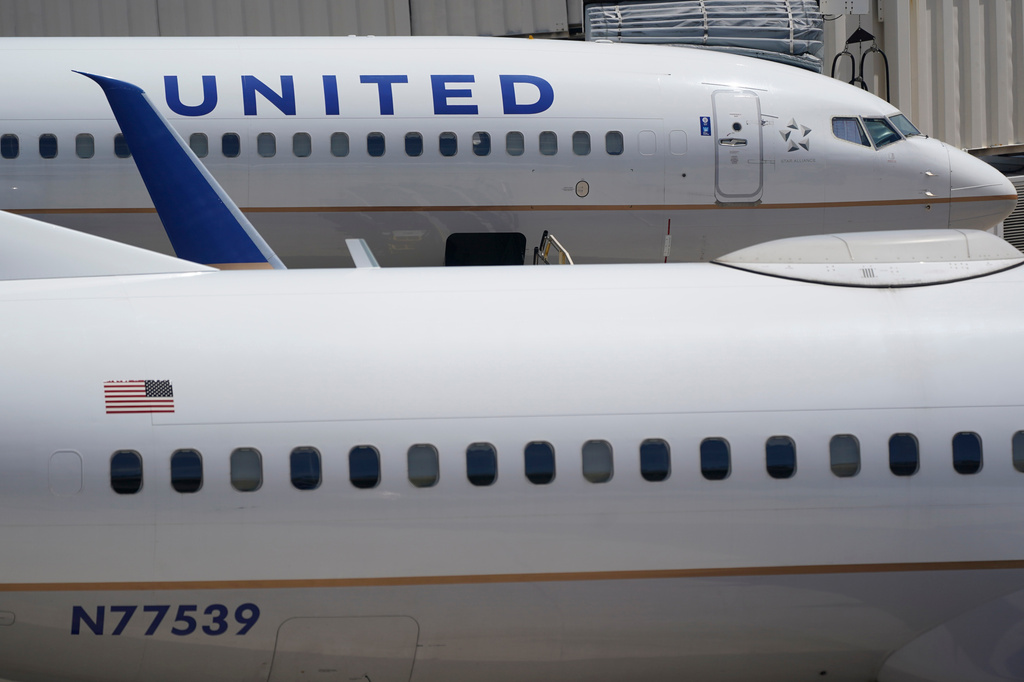 FILE - Two United Airlines Boeing 737s are shown parked at the gate, July 7, 2022, at the Fort Lauderdale-Hollywood International Airport in Fort Lauderdale, Fla. (AP Photo/Wilfredo Lee, File)WLD