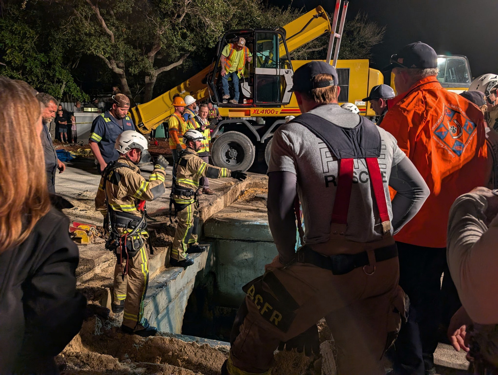 This photo provided by Brevard County Fire Rescue shows members of Brevard County Fire Rescue help rescue a manatee that was stuck in a storm drain on Monday, Feb. 9, 2026 in Melbourne Beach, Fla. (Brevard County Fire Rescue via AP)