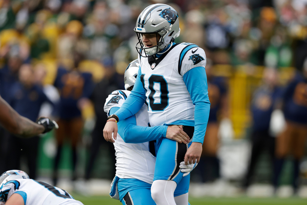 Carolina Panthers punter Sam Martin, second from right, celebrates with placekicker Ryan Fitzgerald (10) after Fitzgerald's winning field goal against the Green Bay Packers in an NFL football game Sunday, Nov. 2, 2025, in Green Bay, Wis. (AP Photo/Matt Ludtke)