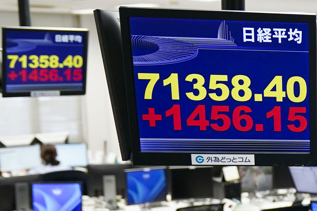 Electronic boards show Japan's benchmark Nikkei 225 index in Tokyo Thursday, June 18, 2026. (Kyodo News via AP)