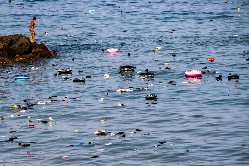 Belongings left behind by migrants float in the sea after they crossed from Morocco into the Spanish enclave of Ceuta, Thursday, July 30, 2026. (AP Photo/Antonio Sempere)