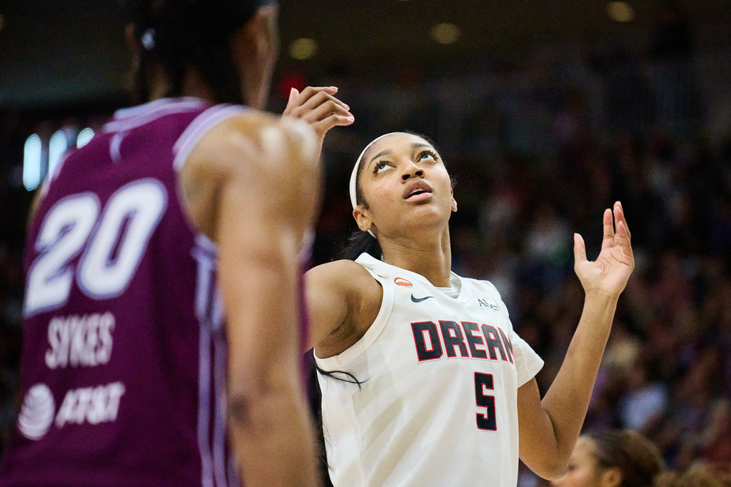 Atlanta Dream's Angel Reese (5) reacts after a foul call during the second half of a WNBA basketball game against Toronto Tempo in Toronto, Sunday, June 14, 2026. (Sammy Kogan/The Canadian Press via AP)