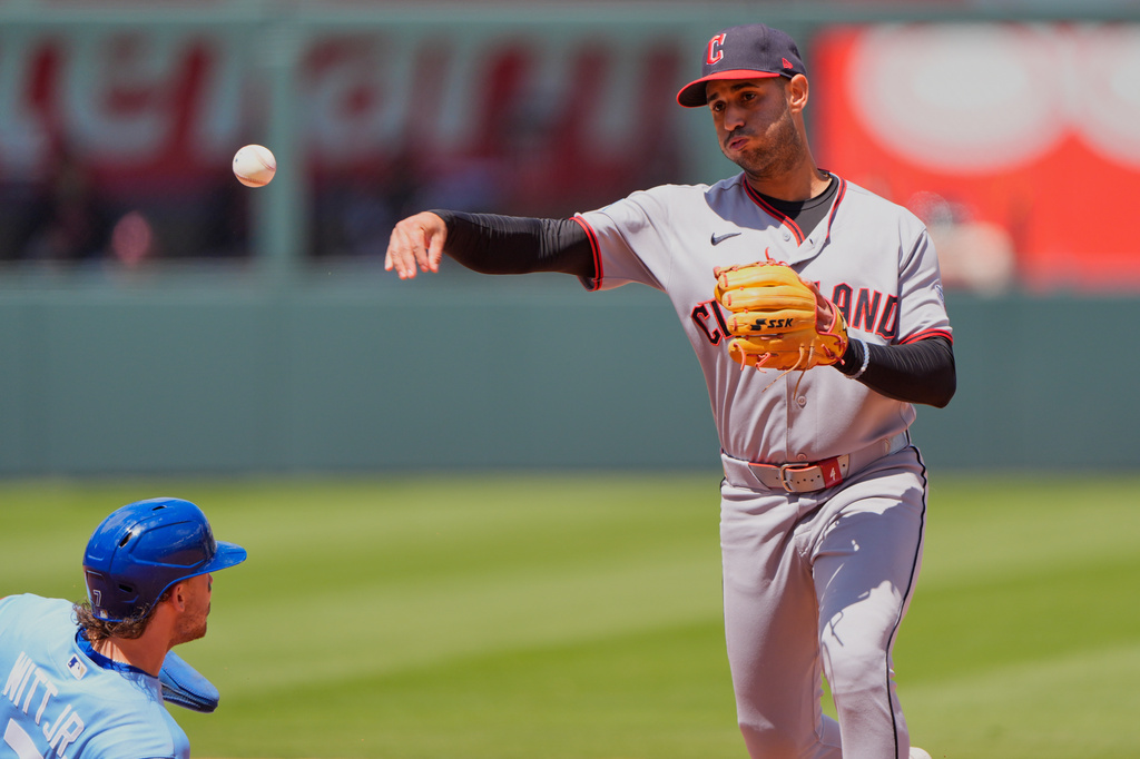 Cleveland Guardians second baseman Travis Bazzana throws to first for the double play hit into Vinnie Pasquantino after forcing Bobby Witt Jr. out at second during the third inning of a baseball game Thursday, May 7, 2026, in Kansas City, Mo. (AP Photo/Charlie Riedel)
