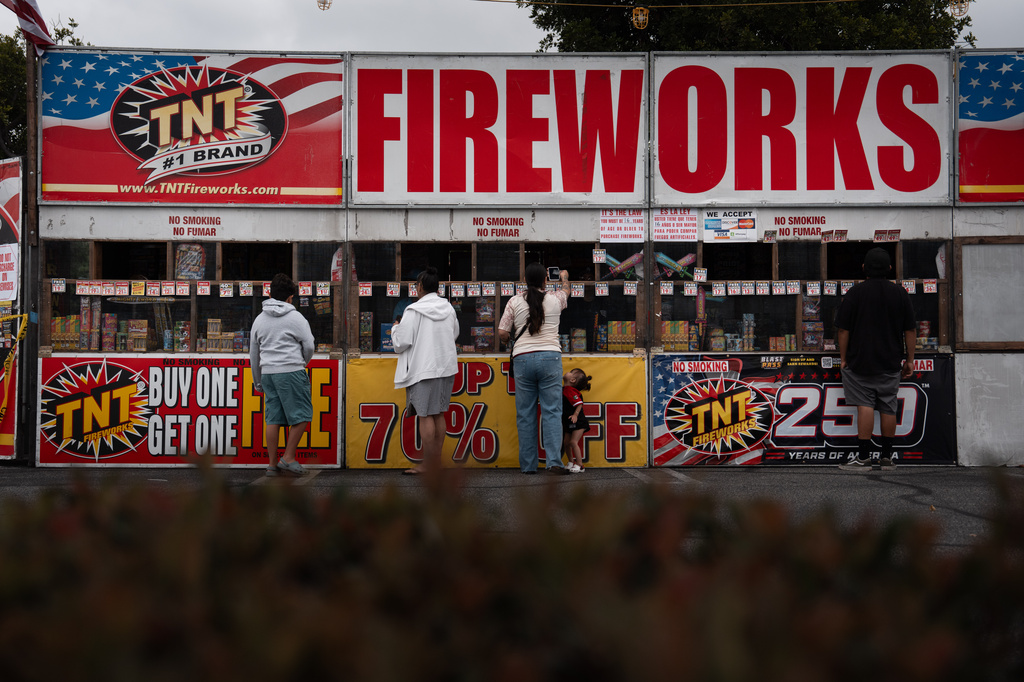 People purchase fireworks at a TNT Fireworks stand in Alhambra, Calif., Tuesday, June 30, 2026, ahead of the Fourth of July holiday. (AP Photo/Jae C. Hong)