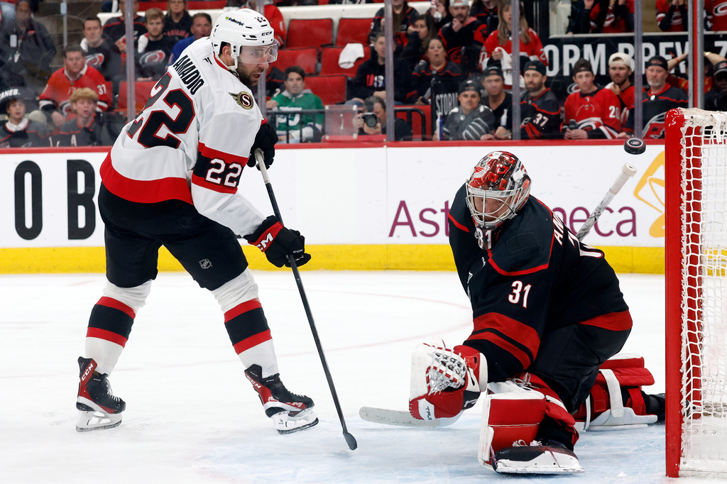 Carolina Hurricanes goaltender Frederik Andersen (31) has the shot of Ottawa Senators' Michael Amadio (22) go off the crossbar during the second overtime of Game 2 of an NHL hockey Stanley Cup first-round playoff series in Raleigh, N.C., Monday, April 20, 2026. (AP Photo/Karl DeBlaker)