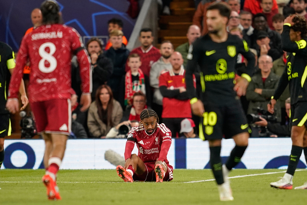 Liverpool's Bradley Barcola sits on the pitch injured during the Champions League opening phase soccer match between Liverpool and Atletico Madrid in Liverpool, England, Wednesday, Sept. 9, 2026. (AP Photo/Dave Thompson)