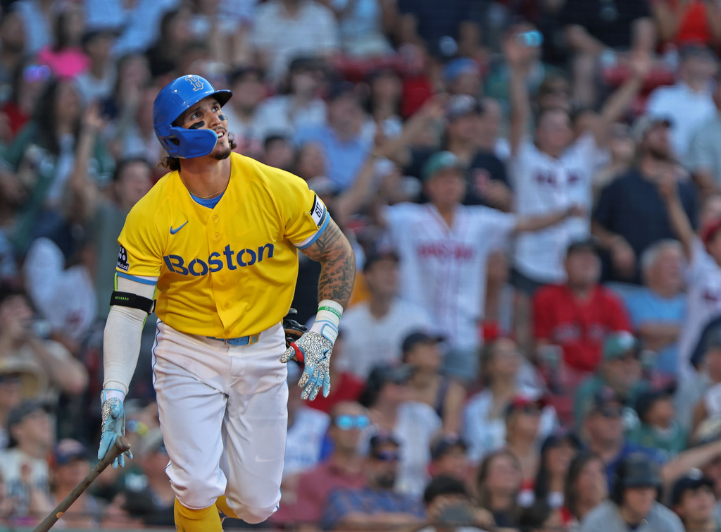 Boston Red Sox's Jarren Duran watches his eighth-inning two-run home run during a baseball game against the Texas Rangers, Saturday, June 13, 2026, in Boston. (AP Photo/Jim Davis)