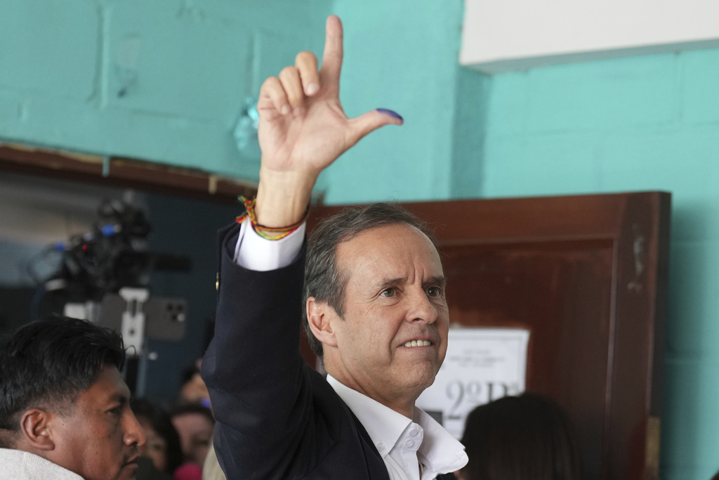 Presidential candidate Jorge "Tuto" Quiroga gestures after voting in general elections in La Paz, Bolivia, Sunday, Aug. 17, 2025. (AP Photo/Natacha Pisarenko)