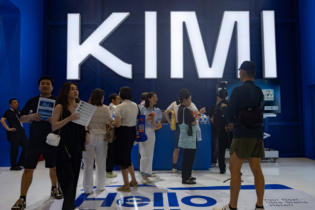 Attendees visit the booth for Chinese AI startup Moonshot's Kimi K3 during the World AI Conference in Shanghai, July 17, 2026. (AP Photo/Ng Han Guan)