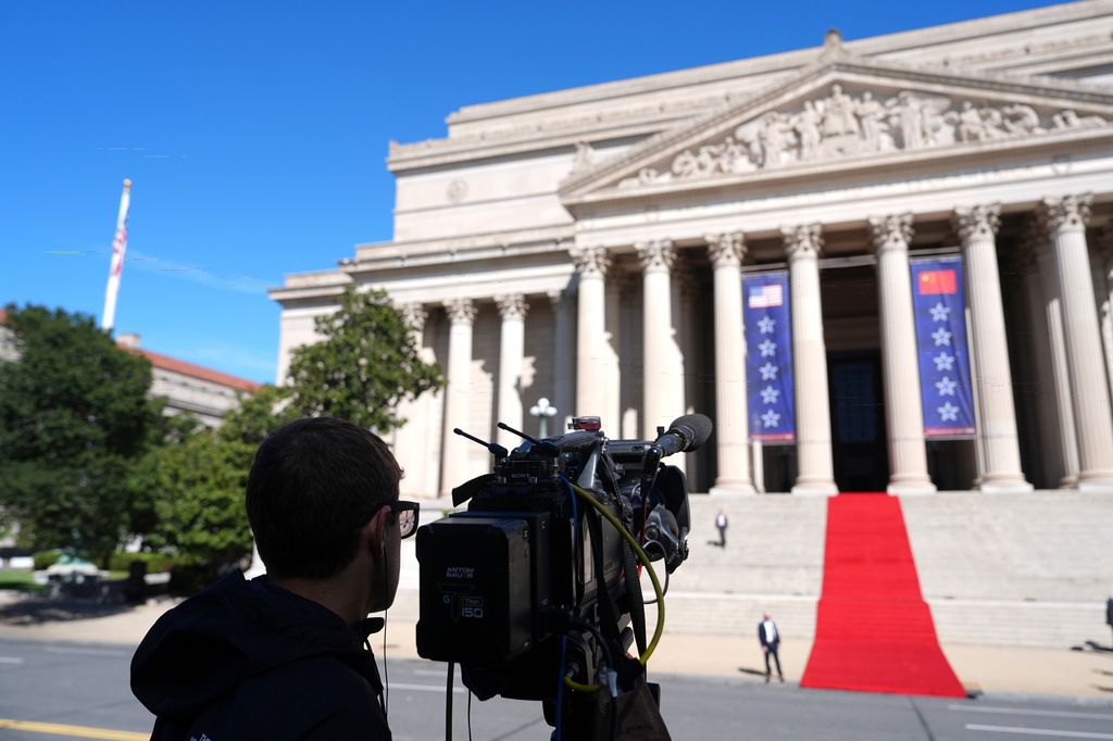 A CNN camera sets up before President Donald Trump, first lady Melania Trump, China's President Xi Jinping and his wife Peng Liyuan arrive at the National Archives Museum, Friday, Sept. 25, 2026, in Washington. (AP Photo/Julia Demaree Nikhinson)