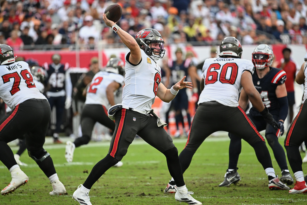 Tampa Bay Buccaneers quarterback Baker Mayfield (6) throws against the New England Patriots during the second half of an NFL football game Sunday, Nov. 9, 2025, in Tampa, Fla. (AP Photo/Jason Behnken)
