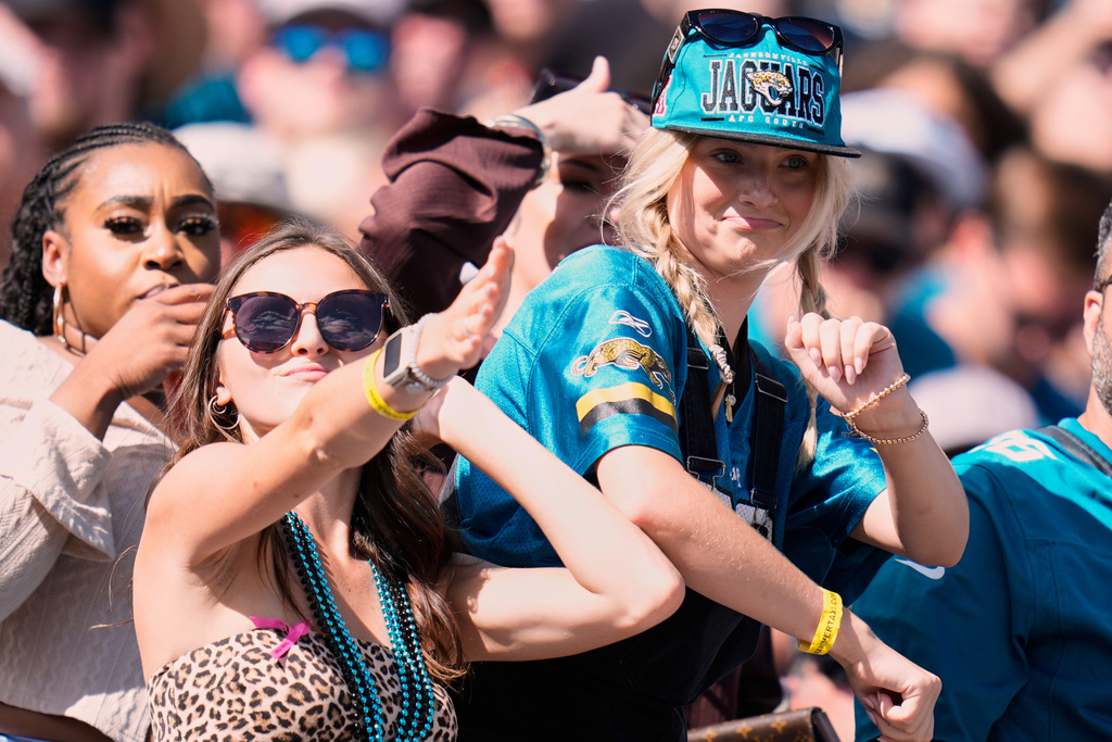 FILE - Fans cheer during the second half of an NFL football game between the Jacksonville Jaguars and the Seattle Seahawks, Sunday, Oct. 12, 2025, in , Fla. (AP Photo/John Raoux, File)
