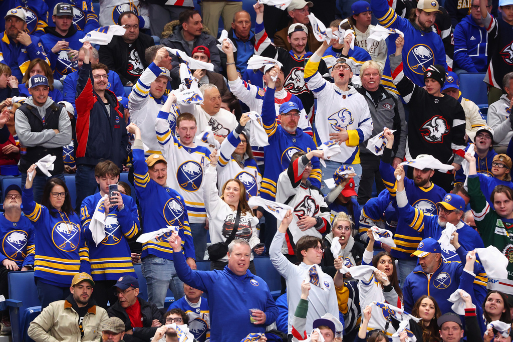 Buffalo Sabres fans celebrate during the third period in Game 1 of a first-round NHL hockey Stanley Cup playoff series against the Boston Bruins, Sunday, April 19, 2026, in Buffalo, N.Y. (AP Photo/Jeffrey T. Barnes)