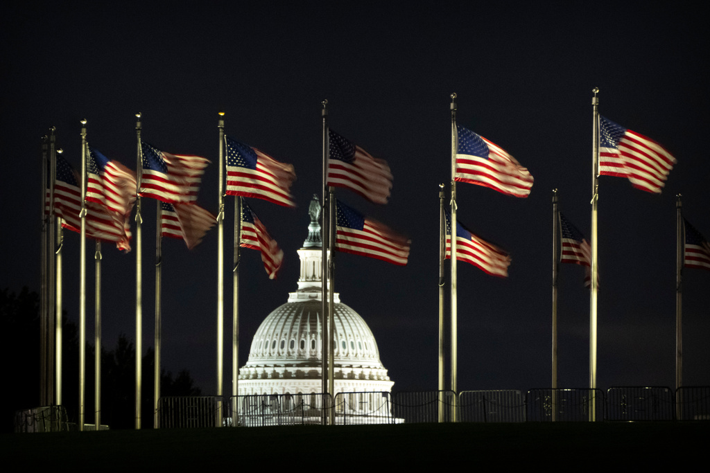 The dome of the U.S. Capitol is seen before dawn on Wednesday, Oct. 1, 2025, in Washington. (AP Photo/Mark Schiefelbein)