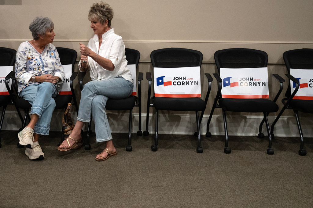 Darlee Foster, left, and Debbie King talk before the Sen. John Cornyn, R-Texas, campaign event in Lubbock, Texas, Tuesday, May 19, 2026. (AP Photo/Annie Rice)