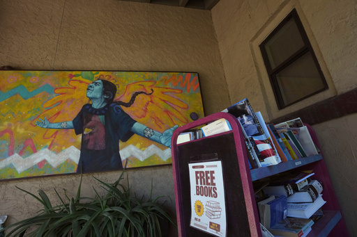A free books trolley sits in front of Palabras Bilingual Bookstore, Monday, Oct. 6, 2025, in Phoenix. (AP Photo/Ross D. Franklin) A free books trolley sits in front of Palabras Bilingual Bookstore, Monday, Oct. 6, 2025, in Phoenix. (AP Photo/Ross D. Franklin)