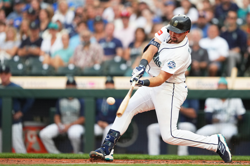 Seattle Mariners' Cal Raleigh hits a solo home run during the second inning of a baseball game against the Philadelphia Phillies, Tuesday, Aug. 25, 2026, in Seattle. (AP Photo/Lindsey Wasson)
