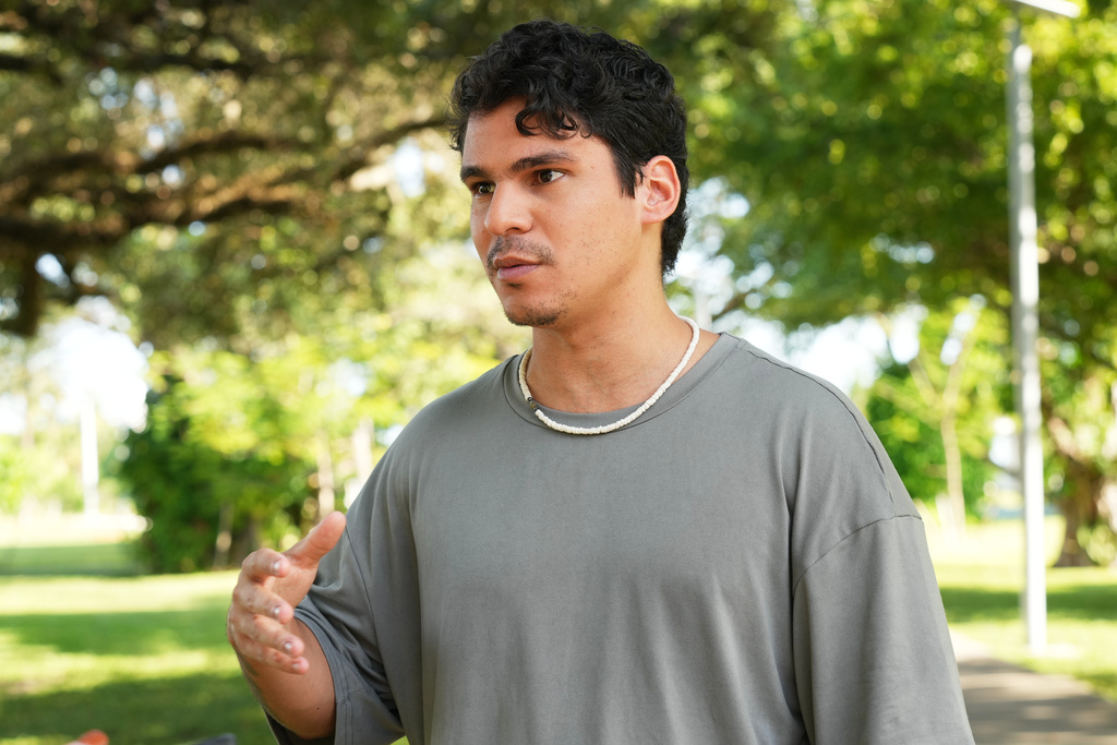 Gustavo Ascani, a digital content creator, speaks about the upcoming Miami mayor runoff election, Thursday, Dec. 4, 2026, in Miami. (AP Photo/Marta Lavandier)