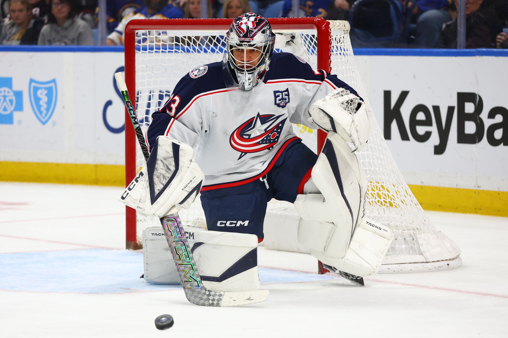Columbus Blue Jackets goaltender Jet Greaves (73) makes a save during the first period of an NHL hockey game against the Buffalo Sabres Thursday, April 9, 2026, in Buffalo, N.Y. (AP Photo/Jeffrey T. Barnes)