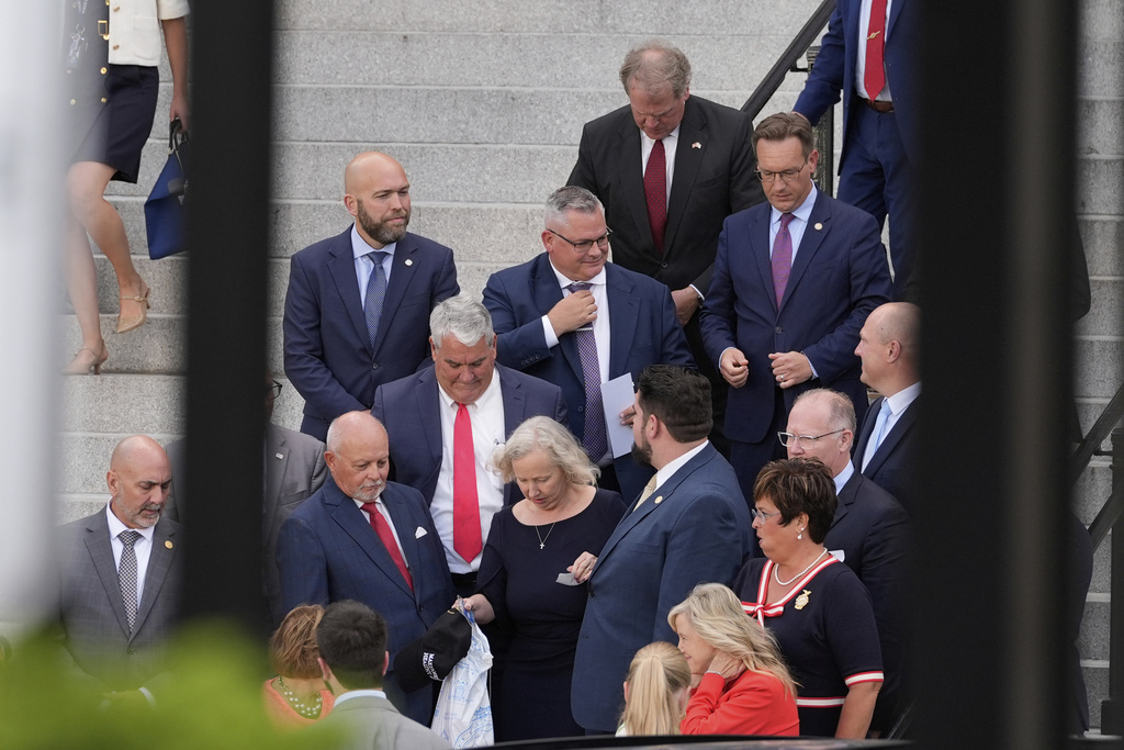 Members of the Indiana state legislation exit the Eisenhower Executive Office Building on the White House complex Tuesday, Aug. 26, 2025, in Washington. (AP Photo/Alex Brandon)