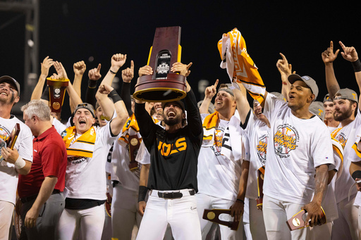 FILE - Tennessee coach Tony Vitello, center, hoists the championship trophy following his team's 6-5 victory against Texas A&M in Game 3 of the NCAA College World Series baseball finals in Omaha, Neb., June 24, 2024. (AP Photo/Rebecca S. Gratz, File) FILE - Tennessee coach Tony Vitello, center, hoists the championship trophy following his team's 6-5 victory against Texas A&M in Game 3 of the NCAA College World Series baseball finals in Omaha, Neb., June 24, 2024. (AP Photo/Rebecca S. Gratz, File)