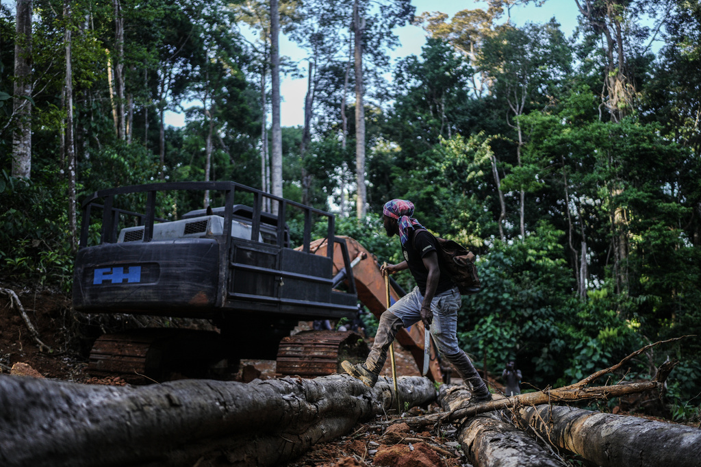 Navaldo Vola, a member of the Saamaka community, checks an abandoned excavator from illegal miners in Ebbatop, Suriname, Sunday, Sept. 27, 2026. (AP Photo/Ivan Valencia)