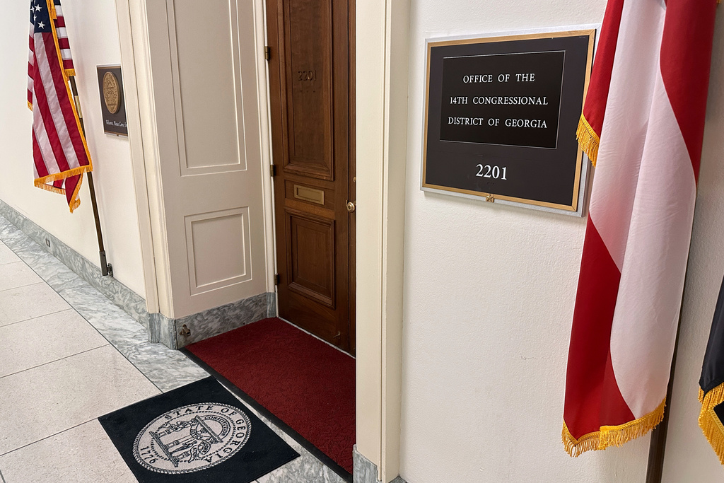 American flags are on display outside the Office of the 14th Congressional District of Georgia in the Rayburn House Office Building, Thursday, March 5, 2026, on Capitol Hill in Washington. The office most recently was occupied for former Rep. Marjorie Taylor Greene, R-Ga., who resigned in January. (AP Photo/Robert Yoon)