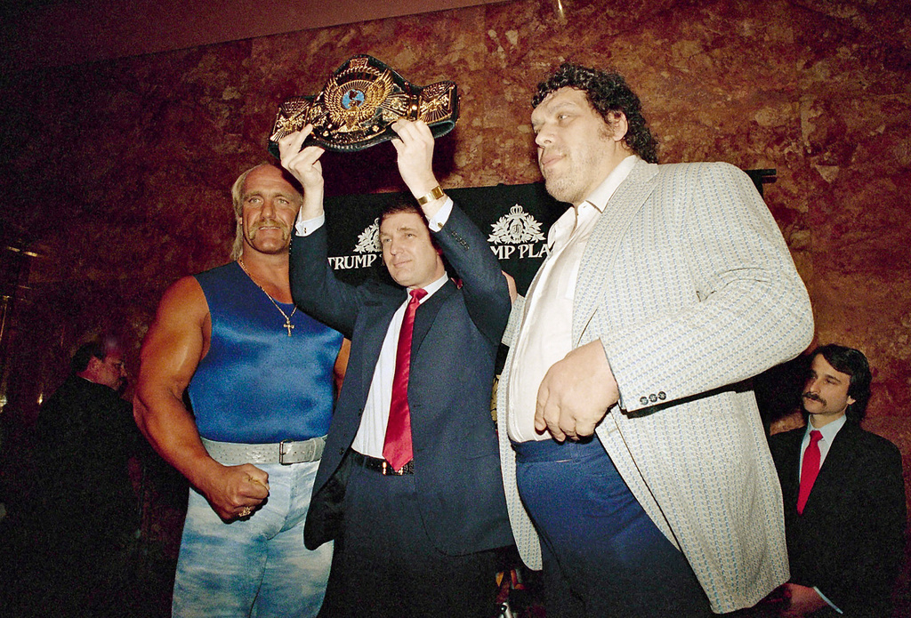 FILE - Real estate developer Donald Trump holds the World Wrestling Federation Championship belt flanked by Hulk Hogan, left, and Andre the Giant at a news conference, March 15, 1988, in New York. (AP Photo/Susan Ragan, File)