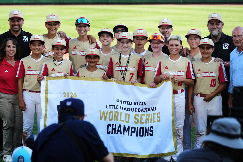 Henderson, Nev. players and coaches pose for a photo after winning the United States Championship baseball game against Hamilton, Ohio, at the Little League World Series tournament in South Williamsport, Pa., Saturday, Aug. 29, 2026. (AP Photo/Gene J. Puskar)