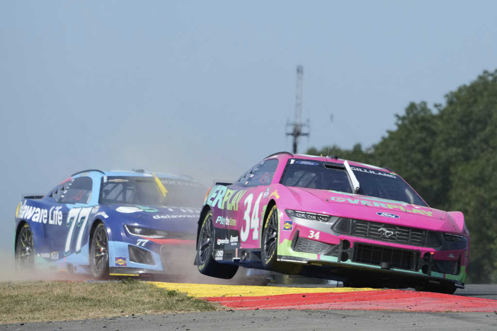 Todd Gilliland (34), right, and Carson Hocevar (77) leave the Bus Stop during a NASCAR Cup Series auto race in Watkins Glen, N.Y., Sunday, Aug. 10, 2025. (AP Photo/Seth Wenig)