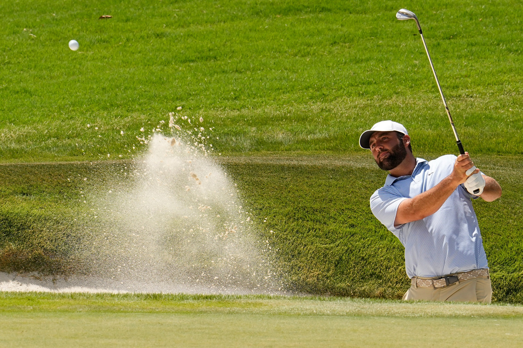 Scottie Scheffler hits from a bunker to the eighth green during the final round of the St. Jude Championship golf tournament, Sunday, Aug. 16, 2026, in Memphis, Tenn. (AP Photo/George Walker IV)