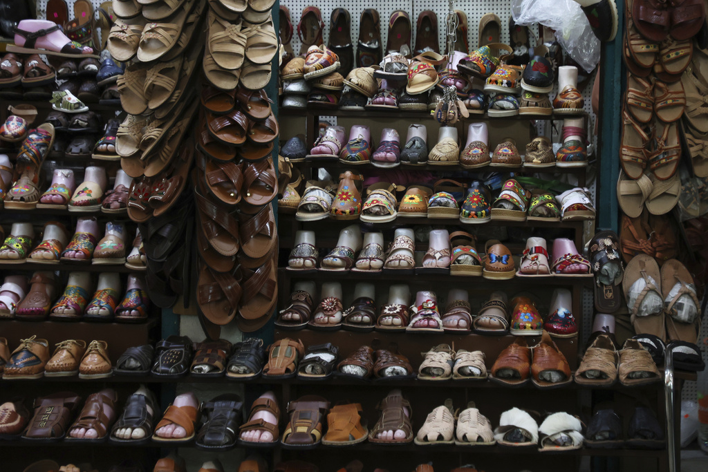 Sandals known as "huaraches" are displayed for sale at a market in Oaxaca, Mexico, Friday, Aug. 8, 2025. (AP Photo/Luis Alberto Cruz)