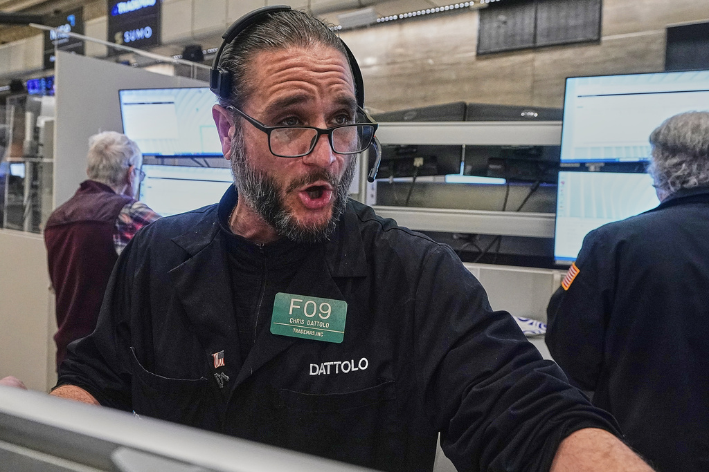 Options trader Chris Dattolo works on the floor of the New York Stock Exchange, Wednesday, Jan. 21, 2026. (AP Photo/Richard Drew)