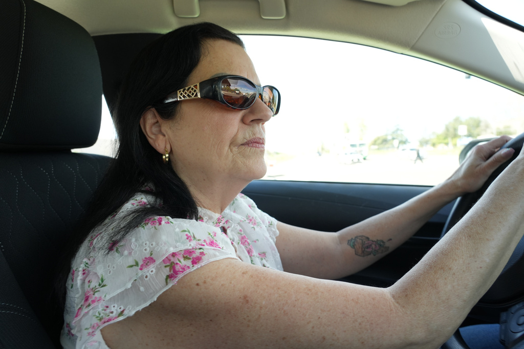 Leslie Sherman-Shafer, an Uber driver, drives her car in Alameda, Calif, March 23, 2026. (AP Photo/Terry Chea)