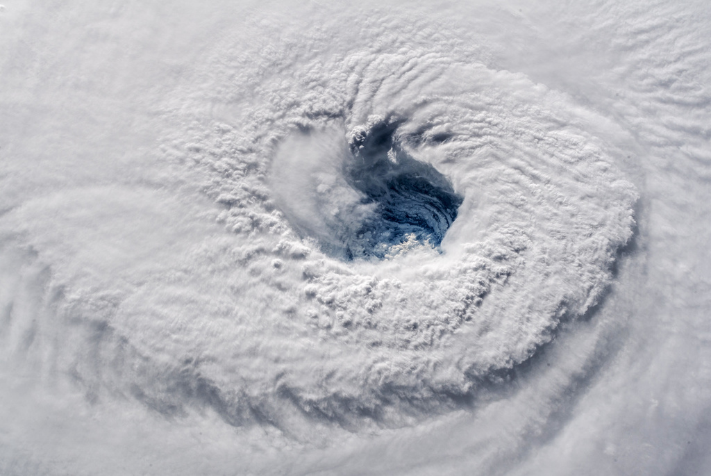 FILE - In this Sept. 12, 2018 photo provided by NASA, Hurricane Florence churns over the Atlantic Ocean heading for the U.S. east coast as seen from the International Space Station. (Alexander Gerst/ESA/NASA via AP,File)