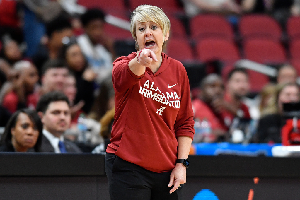 Alabama head coach Kristy Curry shouts instructions to her team during the second half against Rhode Island in the first round of the NCAA college basketball tournament, Saturday, March 21, 2026 in Louisville, Ky. (AP Photo/Timothy D. Easley)