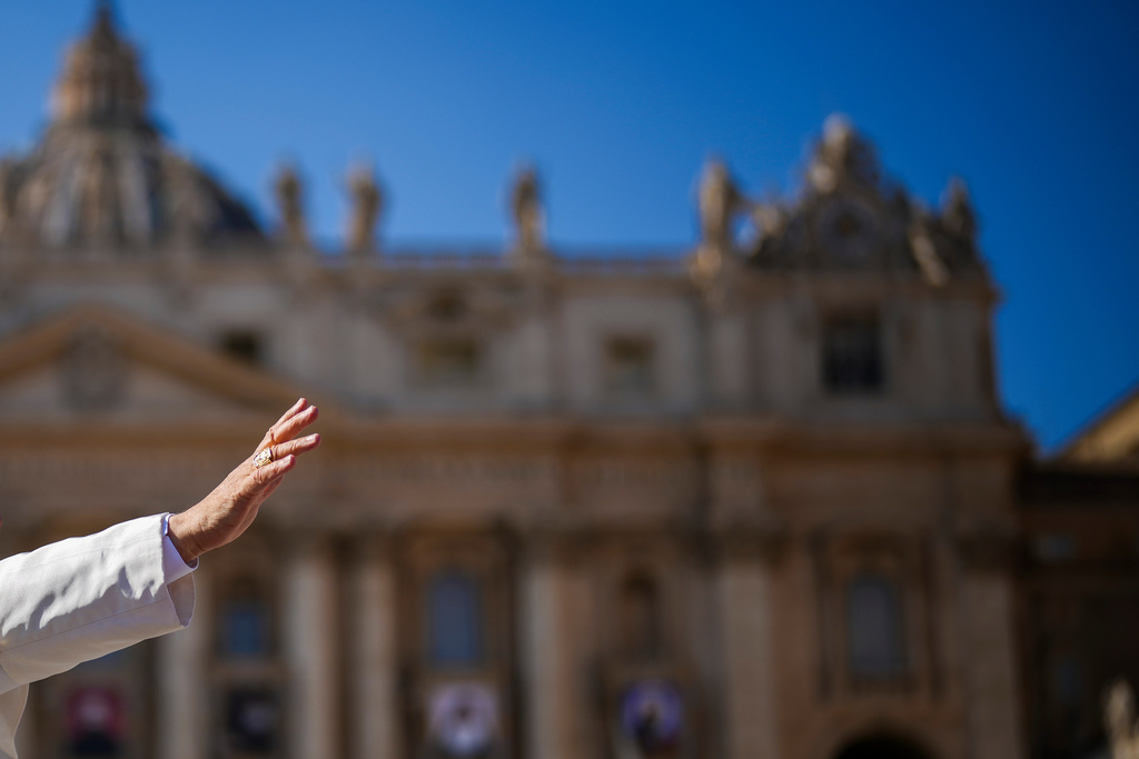FILE - Pope Leo XIV waves from his popemobile after presiding over a Mass in St. Peter's Square at the Vatican, Oct. 19, 2025. (AP Photo/Andrew Medichini, File)