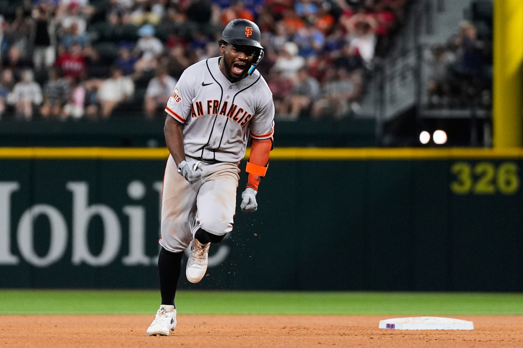 San Francisco Giants' Osleivis Basabe celebrates hitting a two-run home run in the seventh inning a baseball game against the Texas Rangers in Arlington, Texas, Tuesday, Aug. 4, 2026. (AP Photo/Tony Gutierrez)