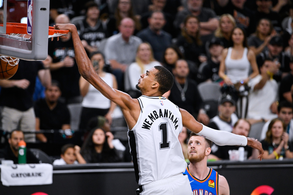 San Antonio Spurs forward Victor Wembanyama (1) scores a basket on the Oklahoma City Thunder during the second half of Game 4 in the Western Conference finals NBA basketball playoffs series in San Antonio, Sunday, May 24, 2026. (AP Photo/Darren Abate)