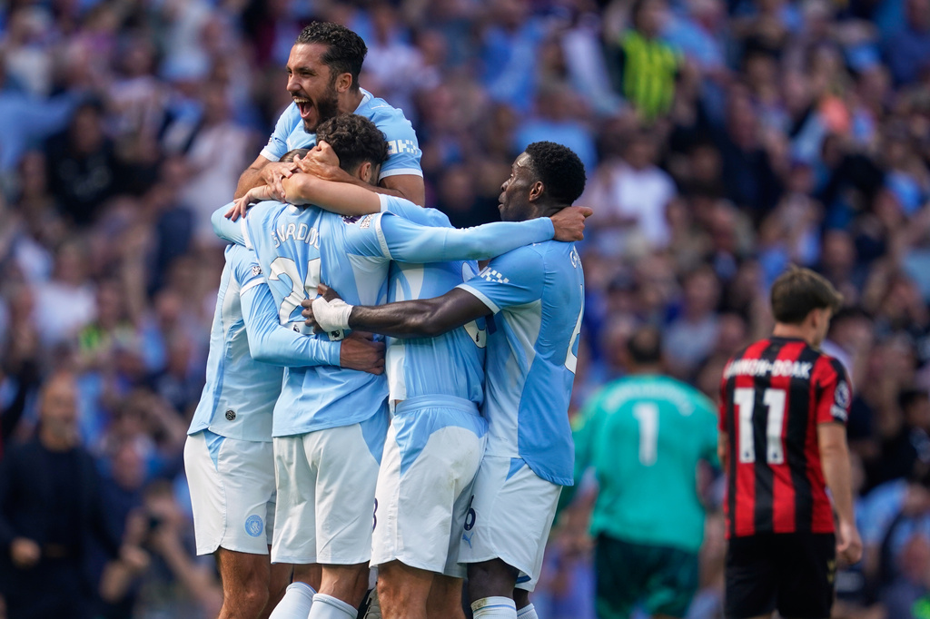 Manchester City's Josko Gvardiol (24) celebrates with teammates after scoring his side's second goal during the English Premier League soccer match between Manchester City and Bournemouth in Manchester, England, Sunday, Aug. 23, 2026. (AP Photo/Dave Thompson)