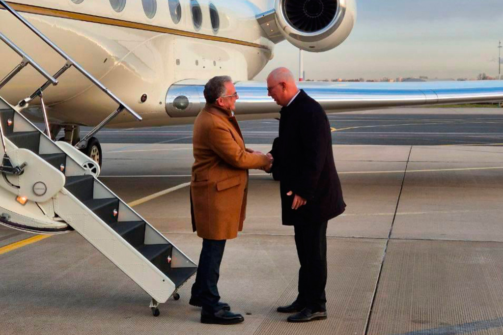Russian presidential envoy Kirill Dmitriev, right, greets U.S. special envoy Steve Witkoff at the international airport outside St. Petersburg, Russia, Wednesday, Oct. 21, 2026. (TASS Photo via AP)