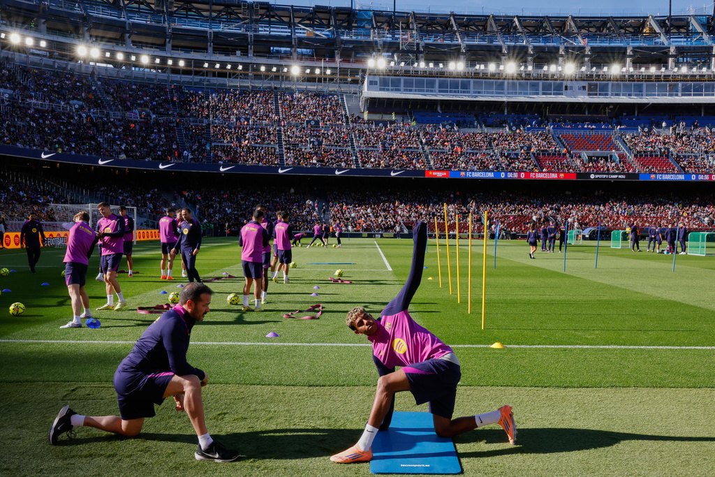 Barcelona's Lamine Yamal exercises during the team's first training session at the venue after its renovation at the Camp Nou stadium in Barcelona, Spain, Friday, Nov. 7, 2025. (AP Photo/Joan Monfort)