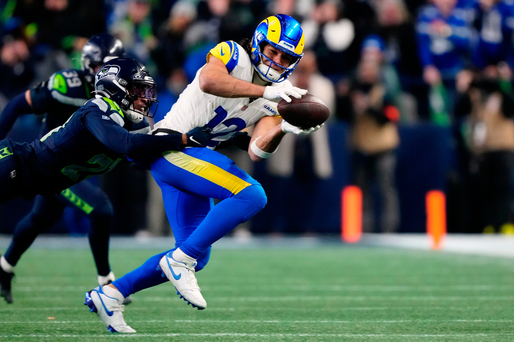 FILE - Los Angeles Rams wide receiver Puka Nacua (12) catches the ball during the NFC Championship NFL football game Jan. 25, 2026, in Seattle. (AP Photo/Ben VanHouten, File)