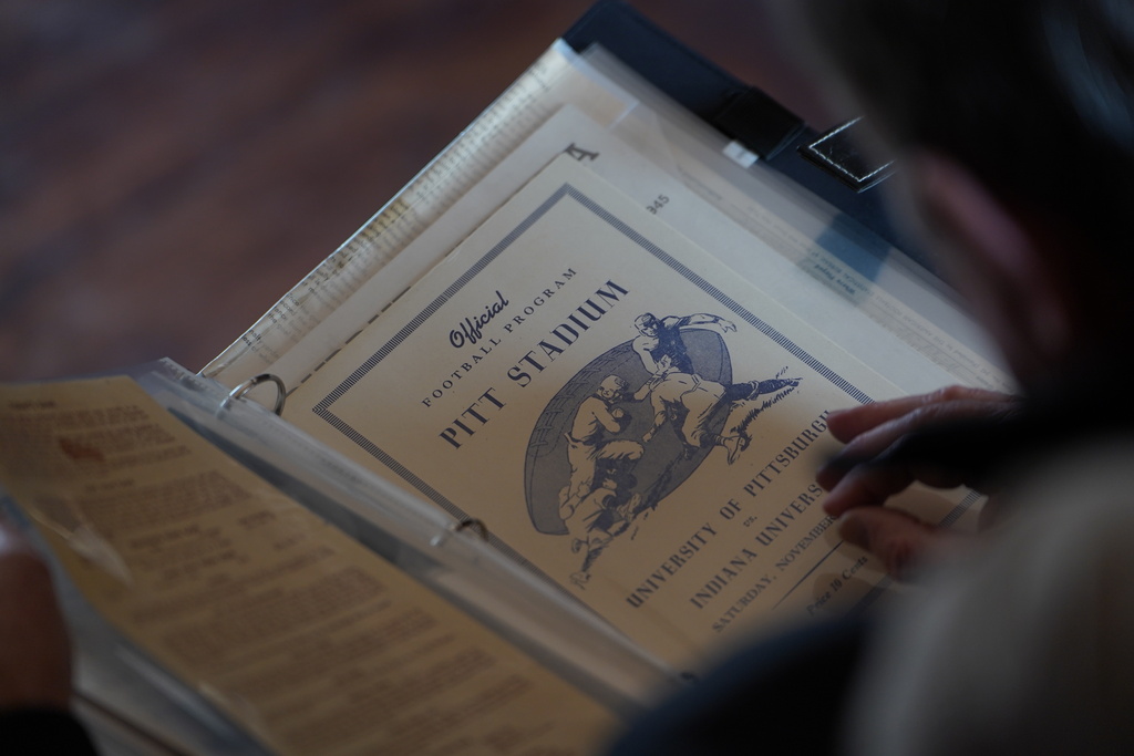 CORRECTS AGE TO 73, NOT 77 - A vintage sports program sits in a photo album collected by Bill Murphy, 77, an Indiana football fan, at his home in Greenfield, Ind., Wednesday Dec. 17, 2025. (AP Photo/Obed Lamy)