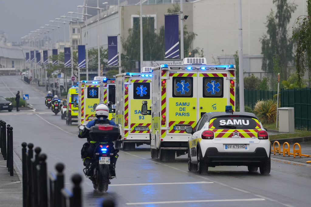 Ambulances carrying patients evacuated from the MV Hondius cruise ship with suspected hantavirus infection, leave the Bourget airport, north of Paris, Sunday, May 10, 2026. (AP Photo/Thibault Camus)