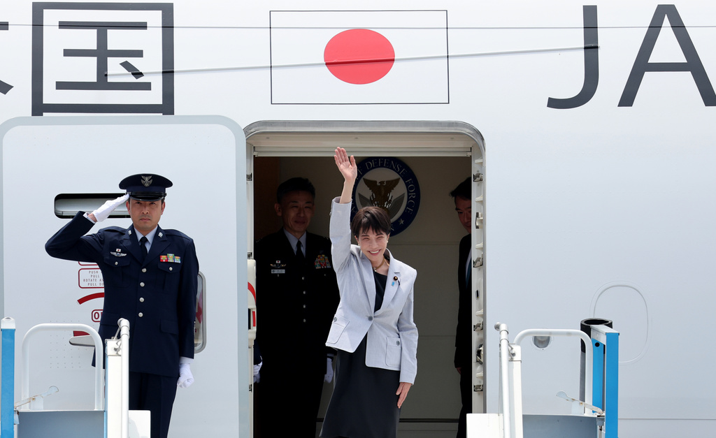 Japan's Prime Minister Sanae Takaichi waves upon arrival at the Daegu International Airport in Daegu, South Korea, Tuesday, May 19, 2026. (Yoon Kwan-shick/Yonhap via AP)