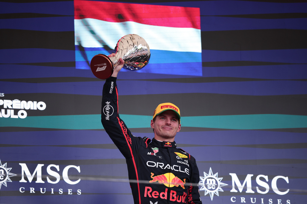 Red Bull driver Max Verstappen of the Netherlands celebrates on the podium his third place during the Brazilian Formula One Grand Prix at the Interlagos race track, in Sao Paulo, Sunday, Nov. 9, 2025. (AP Photo/Ettore Chiereguini)