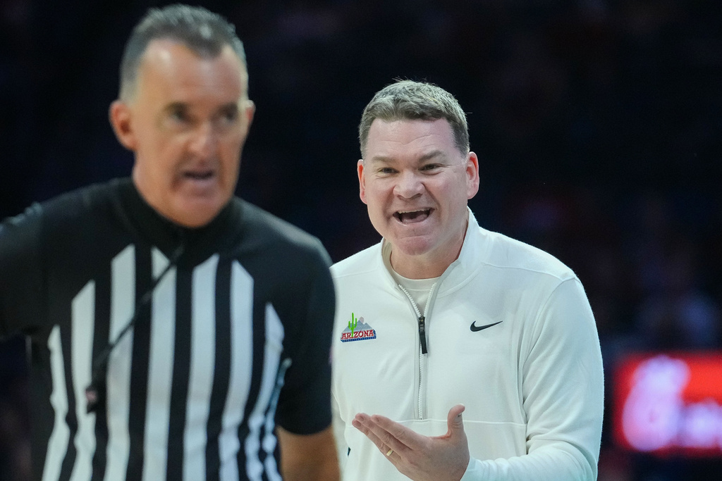 Arizona head coach Tommy Lloyd questions a call from a official during of an NCAA college basketball game against Norfolk State, Saturday, Nov. 29, 2025, in Tucson, Ariz. (AP Photo/Darryl Webb)