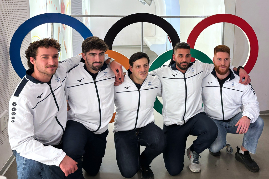Members of Israel's bobsledding team, from left, Uri Zisman, Omer Katz, AJ Edelman, Ward Farwaseh, Itamar Shprinz, pose at the Israel Olympic Committee headquarters, Wednesday, Jan. 28, 2026, in Tel Aviv, Israel, before their departure for the 2026 Winter Olympics. (AP Photo/Julia Frankel)